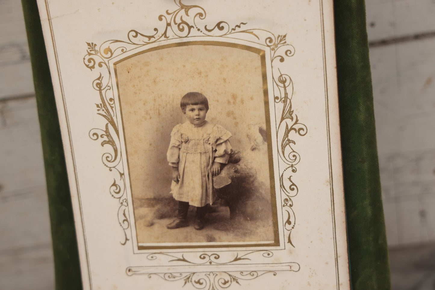 Lot 010 - Antique Victorian Green Velvet Display Photo Album With Stand And Tilt Down Cover, Brass Adornments, Containing 12 Cabinet Card And 24 C.D.V. Photographs And Images, Including Man Posing With Rifle, Sailor In Uniform, And Men Smoking