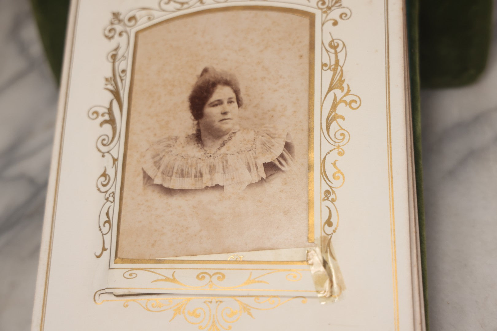 Lot 010 - Antique Victorian Green Velvet Display Photo Album With Stand And Tilt Down Cover, Brass Adornments, Containing 12 Cabinet Card And 24 C.D.V. Photographs And Images, Including Man Posing With Rifle, Sailor In Uniform, And Men Smoking