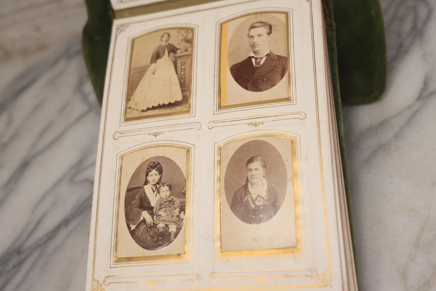 Lot 010 - Antique Victorian Green Velvet Display Photo Album With Stand And Tilt Down Cover, Brass Adornments, Containing 12 Cabinet Card And 24 C.D.V. Photographs And Images, Including Man Posing With Rifle, Sailor In Uniform, And Men Smoking
