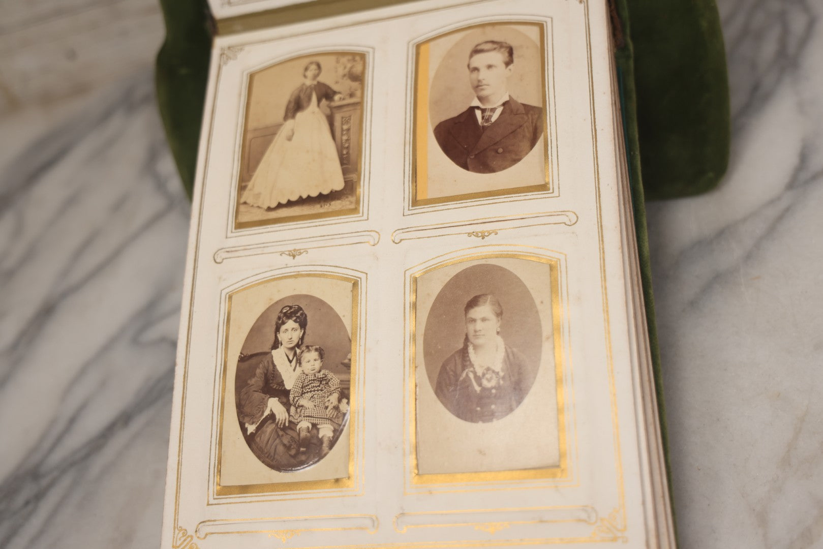 Lot 010 - Antique Victorian Green Velvet Display Photo Album With Stand And Tilt Down Cover, Brass Adornments, Containing 12 Cabinet Card And 24 C.D.V. Photographs And Images, Including Man Posing With Rifle, Sailor In Uniform, And Men Smoking