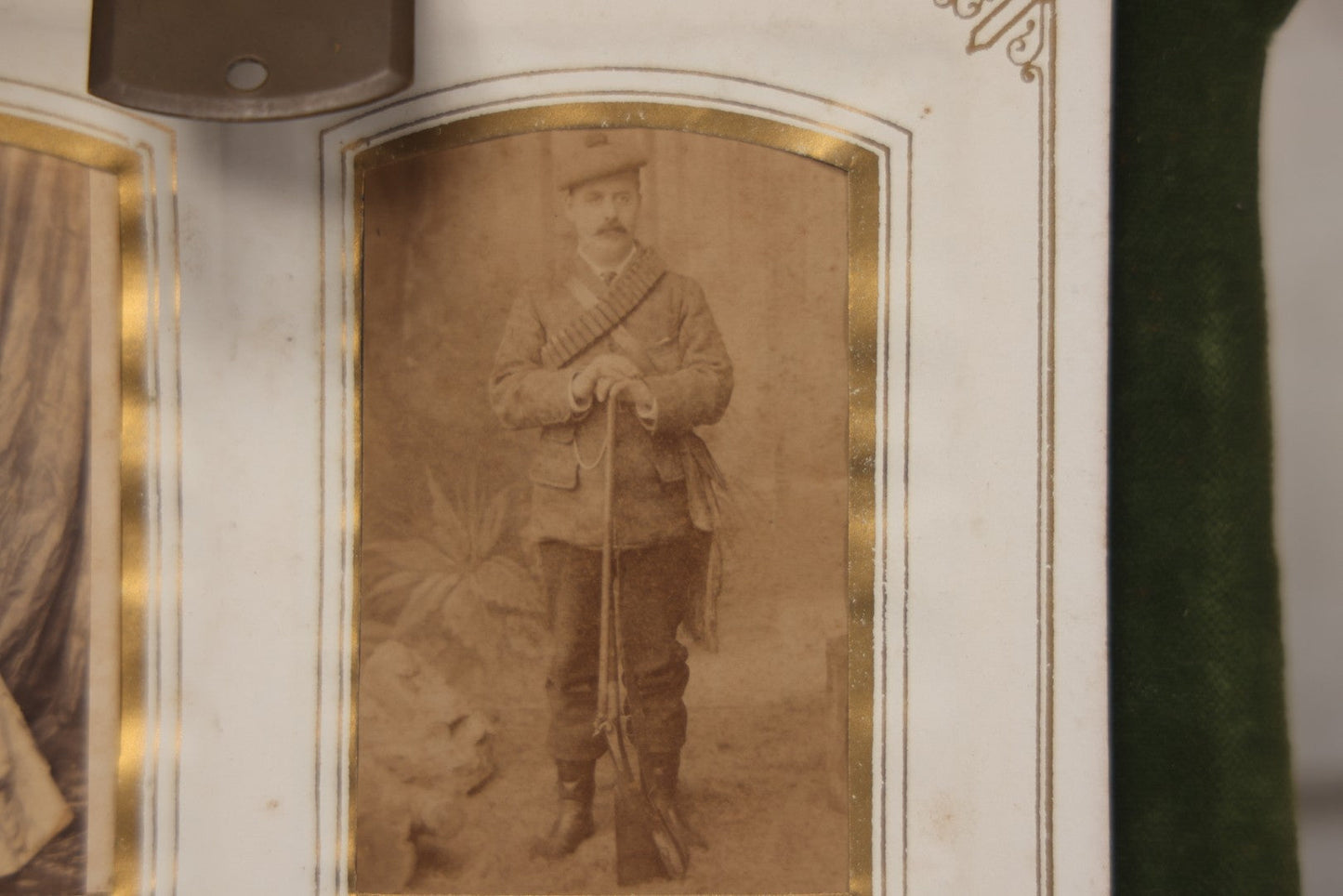 Lot 010 - Antique Victorian Green Velvet Display Photo Album With Stand And Tilt Down Cover, Brass Adornments, Containing 12 Cabinet Card And 24 C.D.V. Photographs And Images, Including Man Posing With Rifle, Sailor In Uniform, And Men Smoking
