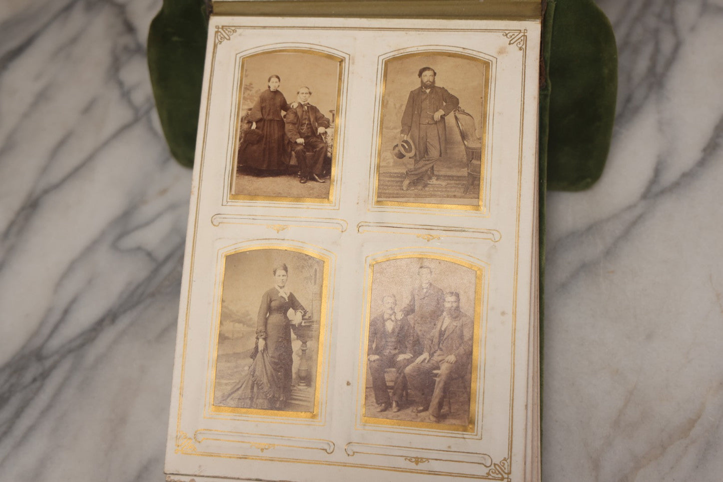 Lot 010 - Antique Victorian Green Velvet Display Photo Album With Stand And Tilt Down Cover, Brass Adornments, Containing 12 Cabinet Card And 24 C.D.V. Photographs And Images, Including Man Posing With Rifle, Sailor In Uniform, And Men Smoking