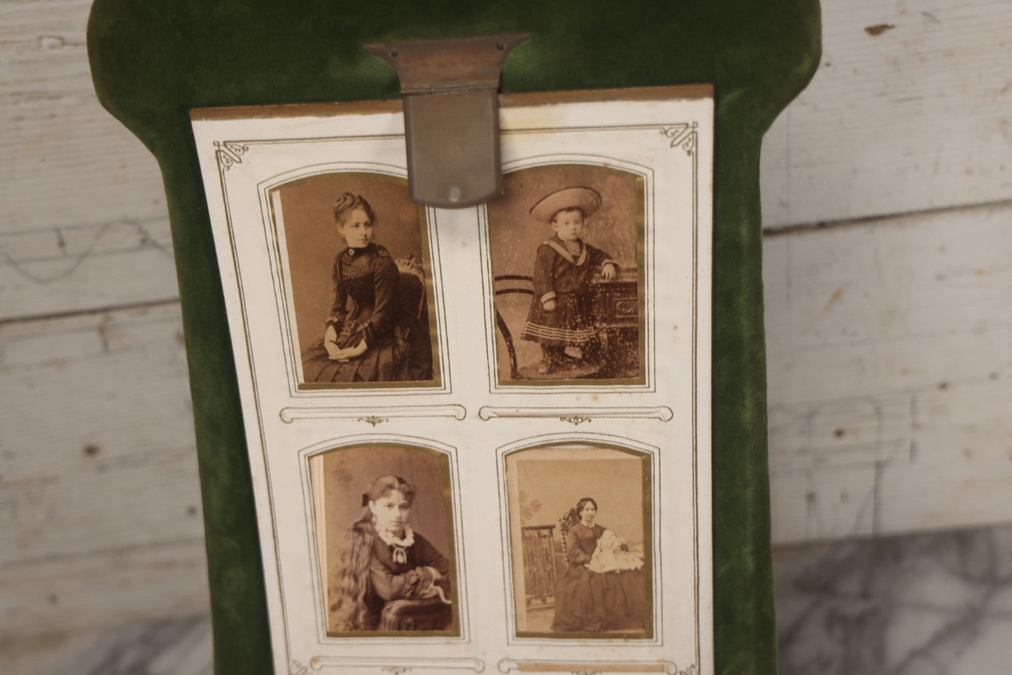 Lot 010 - Antique Victorian Green Velvet Display Photo Album With Stand And Tilt Down Cover, Brass Adornments, Containing 12 Cabinet Card And 24 C.D.V. Photographs And Images, Including Man Posing With Rifle, Sailor In Uniform, And Men Smoking