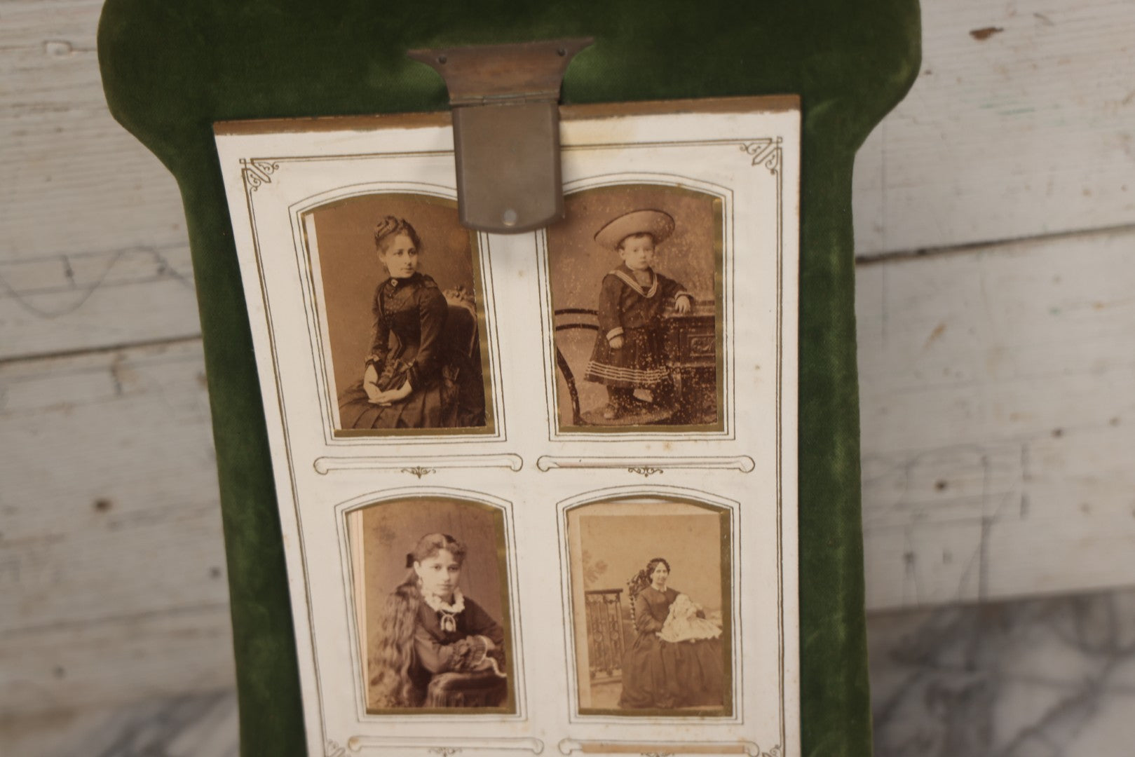 Lot 010 - Antique Victorian Green Velvet Display Photo Album With Stand And Tilt Down Cover, Brass Adornments, Containing 12 Cabinet Card And 24 C.D.V. Photographs And Images, Including Man Posing With Rifle, Sailor In Uniform, And Men Smoking
