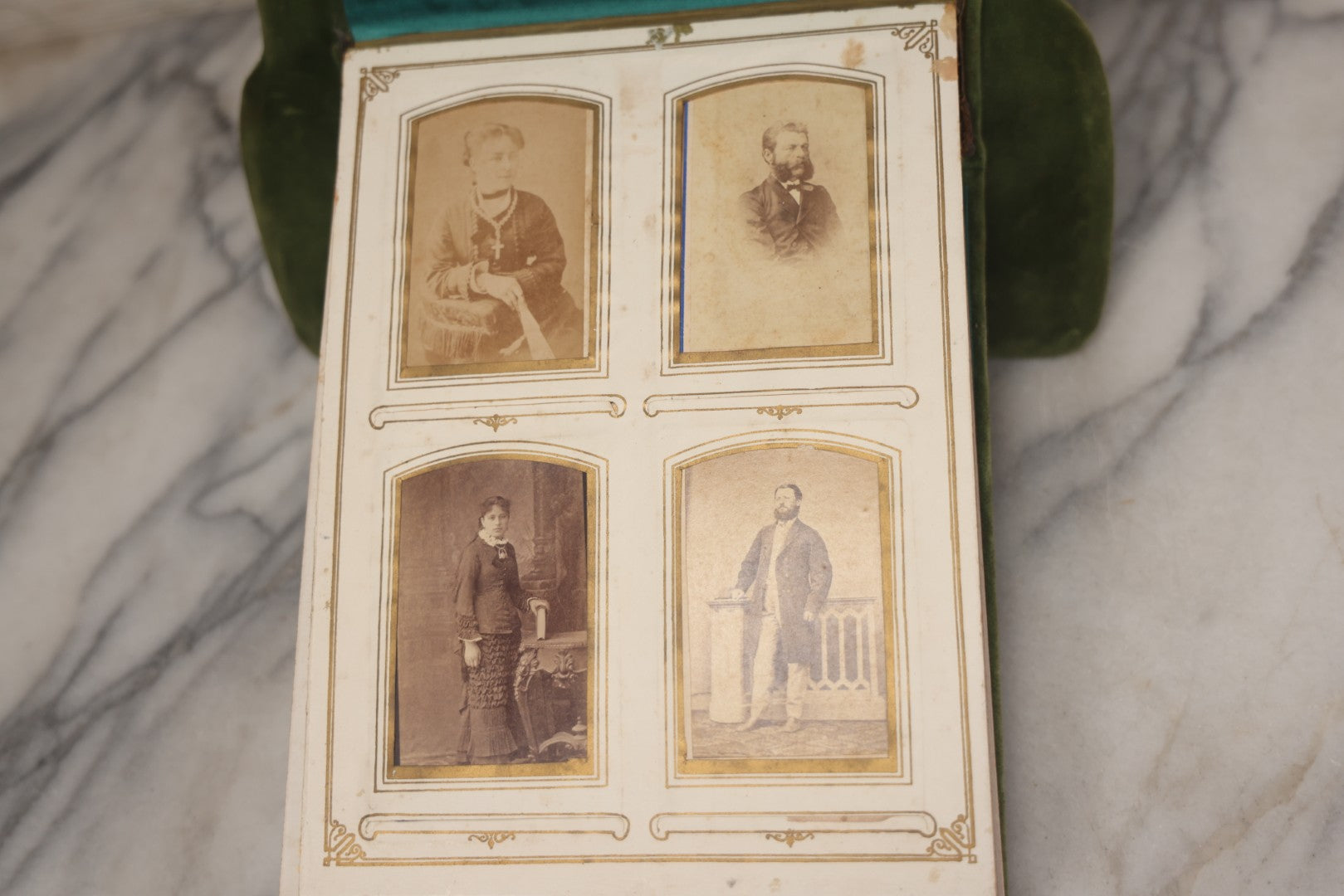 Lot 010 - Antique Victorian Green Velvet Display Photo Album With Stand And Tilt Down Cover, Brass Adornments, Containing 12 Cabinet Card And 24 C.D.V. Photographs And Images, Including Man Posing With Rifle, Sailor In Uniform, And Men Smoking