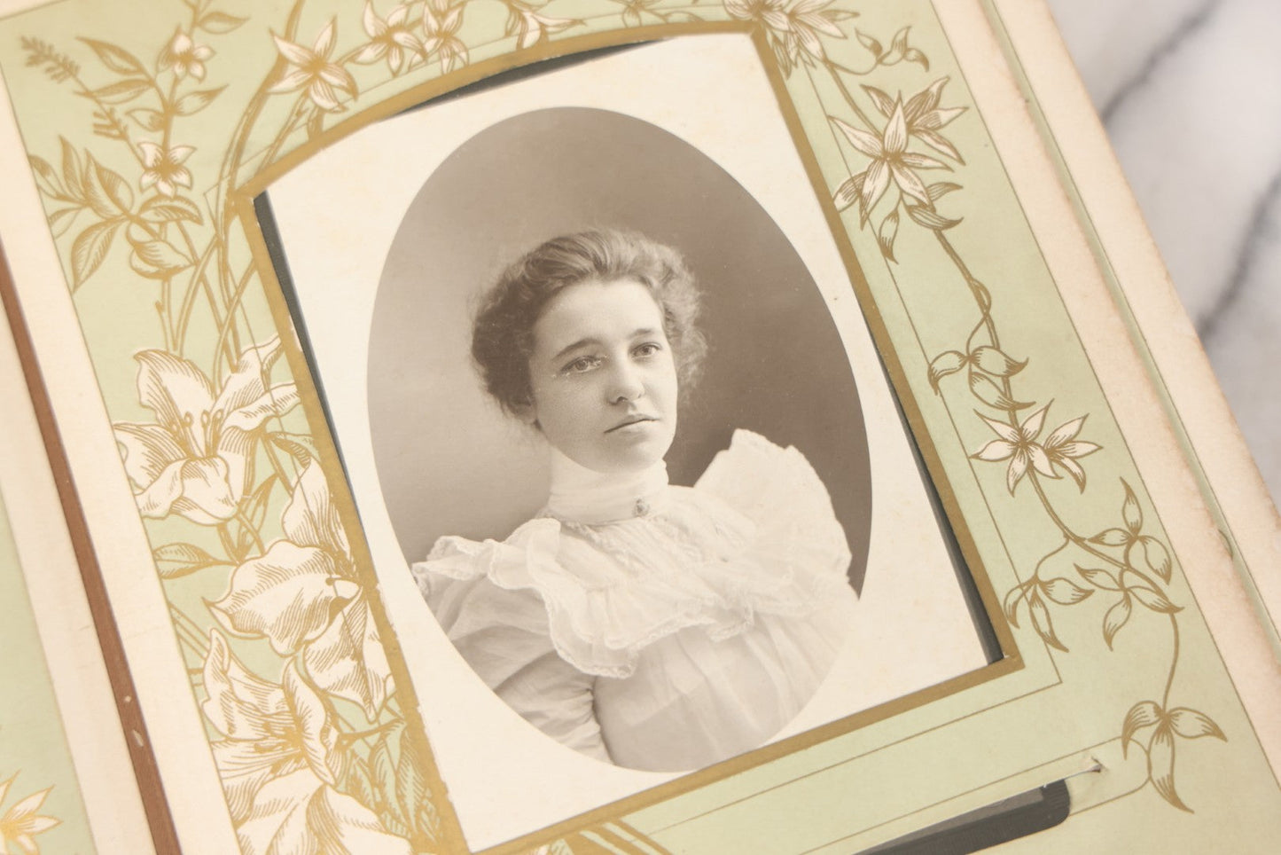 Lot 011 - Antique Victorian Photo Album With Yellow Velvet Cover, Celluloid Shell Decoration With Crab, Containing 28 Cabinet Card And Twelve C.D.V. Photographs, Including Co-Ed Class Photo, Little Girl Holding Bisque Doll, Note Binding Completely Shot