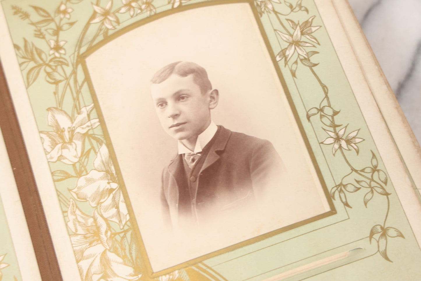 Lot 011 - Antique Victorian Photo Album With Yellow Velvet Cover, Celluloid Shell Decoration With Crab, Containing 28 Cabinet Card And Twelve C.D.V. Photographs, Including Co-Ed Class Photo, Little Girl Holding Bisque Doll, Note Binding Completely Shot