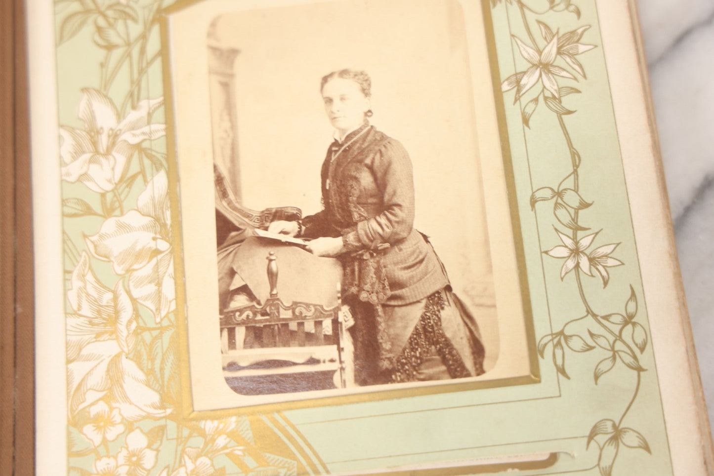 Lot 011 - Antique Victorian Photo Album With Yellow Velvet Cover, Celluloid Shell Decoration With Crab, Containing 28 Cabinet Card And Twelve C.D.V. Photographs, Including Co-Ed Class Photo, Little Girl Holding Bisque Doll, Note Binding Completely Shot