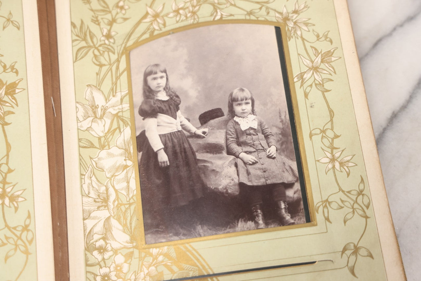 Lot 011 - Antique Victorian Photo Album With Yellow Velvet Cover, Celluloid Shell Decoration With Crab, Containing 28 Cabinet Card And Twelve C.D.V. Photographs, Including Co-Ed Class Photo, Little Girl Holding Bisque Doll, Note Binding Completely Shot