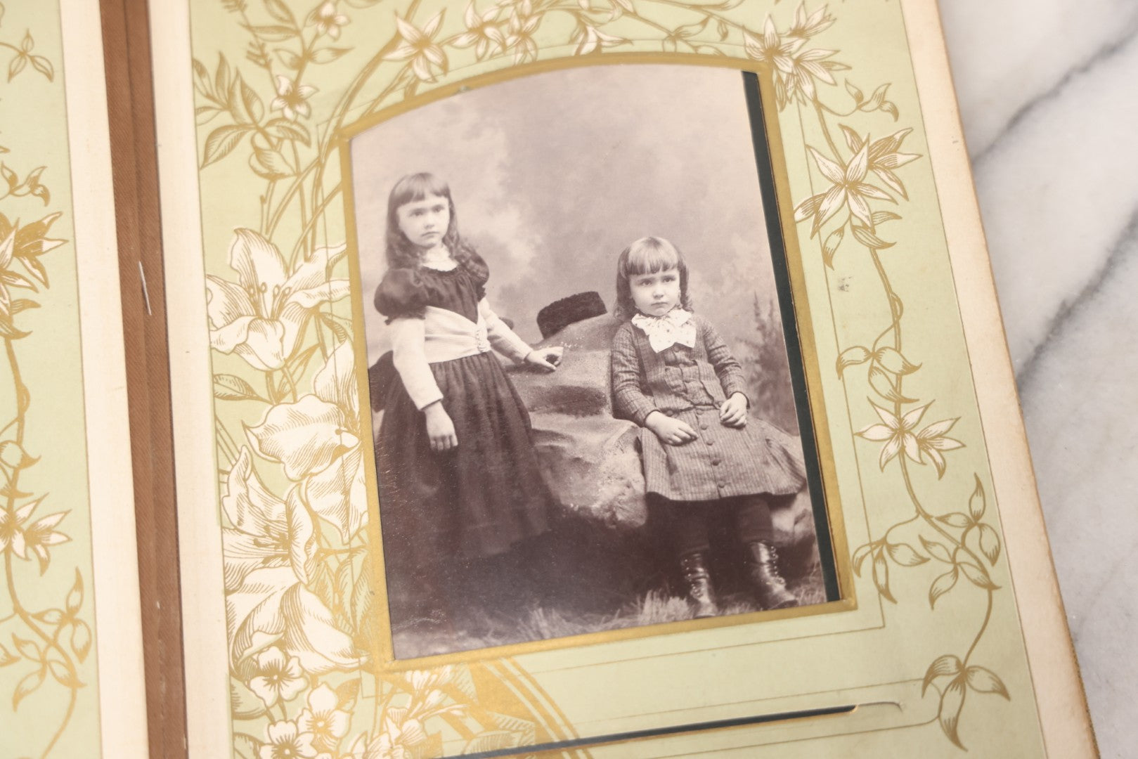 Lot 011 - Antique Victorian Photo Album With Yellow Velvet Cover, Celluloid Shell Decoration With Crab, Containing 28 Cabinet Card And Twelve C.D.V. Photographs, Including Co-Ed Class Photo, Little Girl Holding Bisque Doll, Note Binding Completely Shot