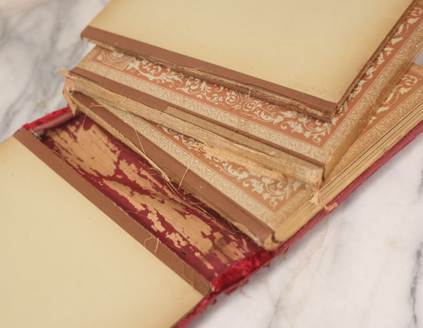 Lot 015 - Antique Victorian Photo Album With Red Velvet Covering, Containing 34 Cabinet Card Photographs, Including Woman Leaning On Gothic Chair, Group Of Four Women And Young Man In Uniform, Note Binding Completely Shot, Many Pages Loose