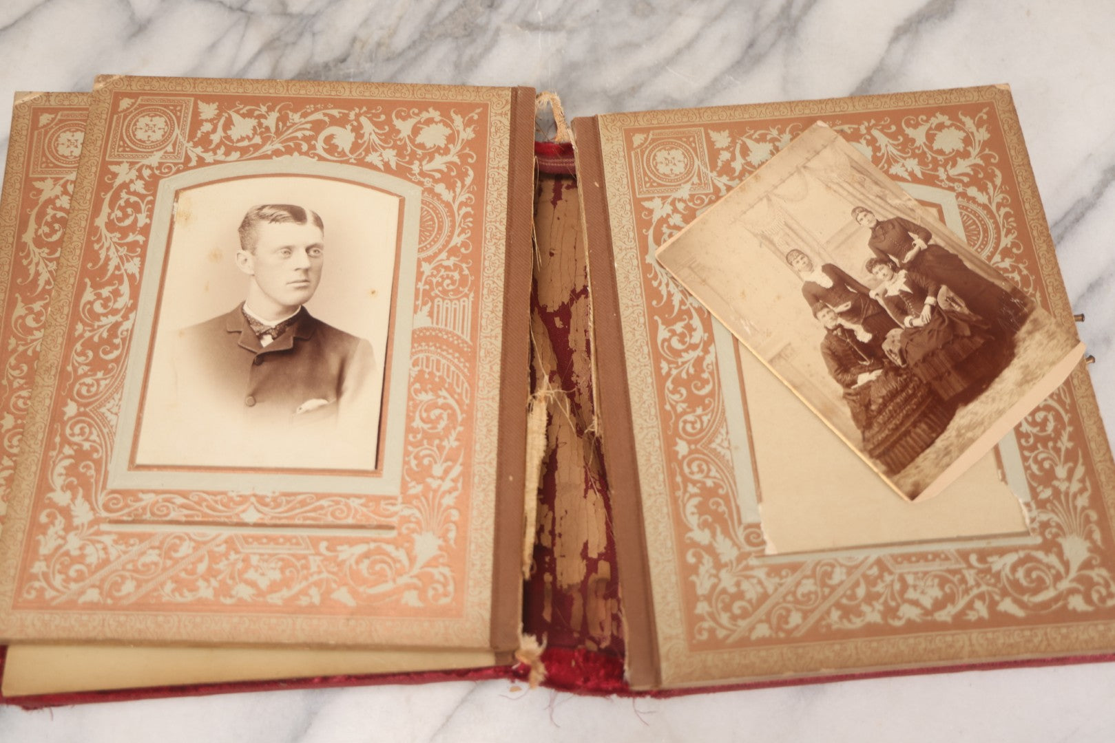 Lot 015 - Antique Victorian Photo Album With Red Velvet Covering, Containing 34 Cabinet Card Photographs, Including Woman Leaning On Gothic Chair, Group Of Four Women And Young Man In Uniform, Note Binding Completely Shot, Many Pages Loose