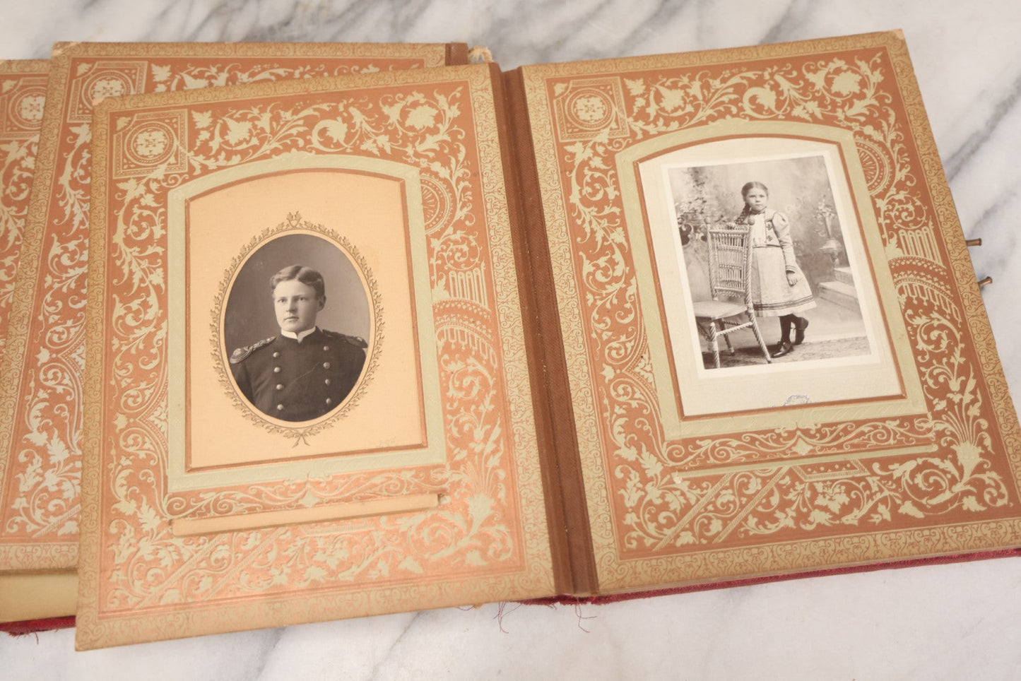 Lot 015 - Antique Victorian Photo Album With Red Velvet Covering, Containing 34 Cabinet Card Photographs, Including Woman Leaning On Gothic Chair, Group Of Four Women And Young Man In Uniform, Note Binding Completely Shot, Many Pages Loose