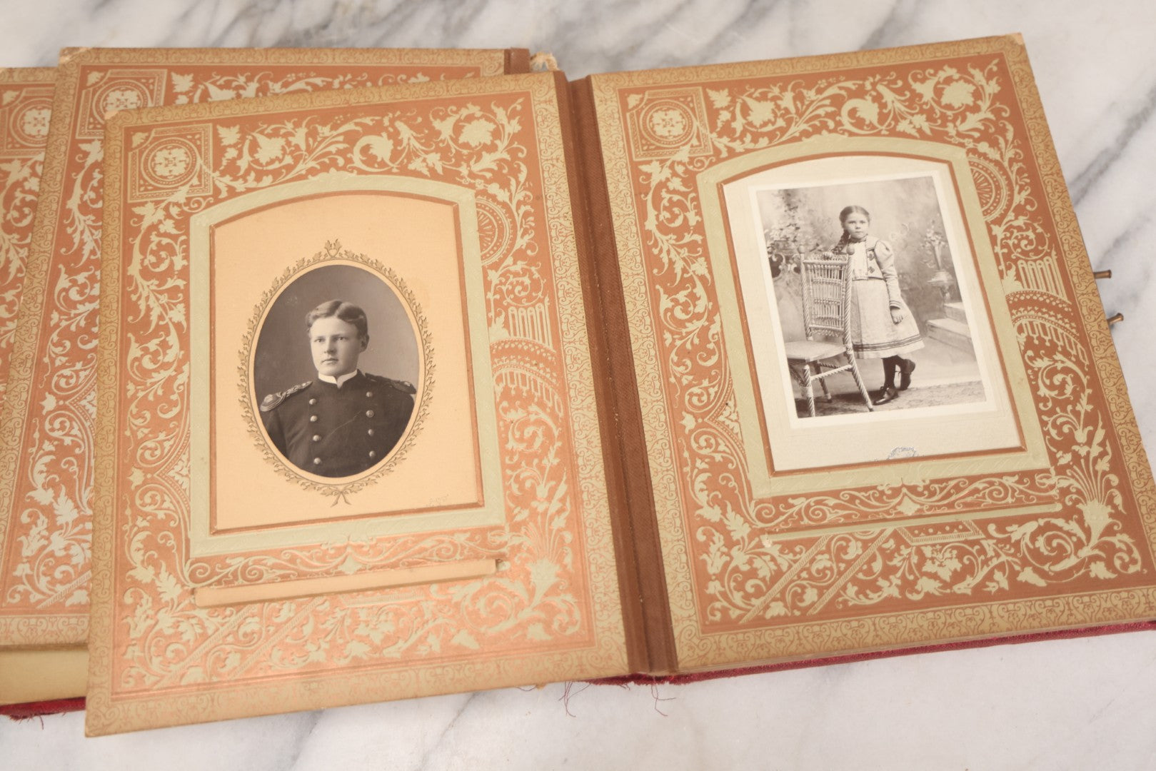 Lot 015 - Antique Victorian Photo Album With Red Velvet Covering, Containing 34 Cabinet Card Photographs, Including Woman Leaning On Gothic Chair, Group Of Four Women And Young Man In Uniform, Note Binding Completely Shot, Many Pages Loose