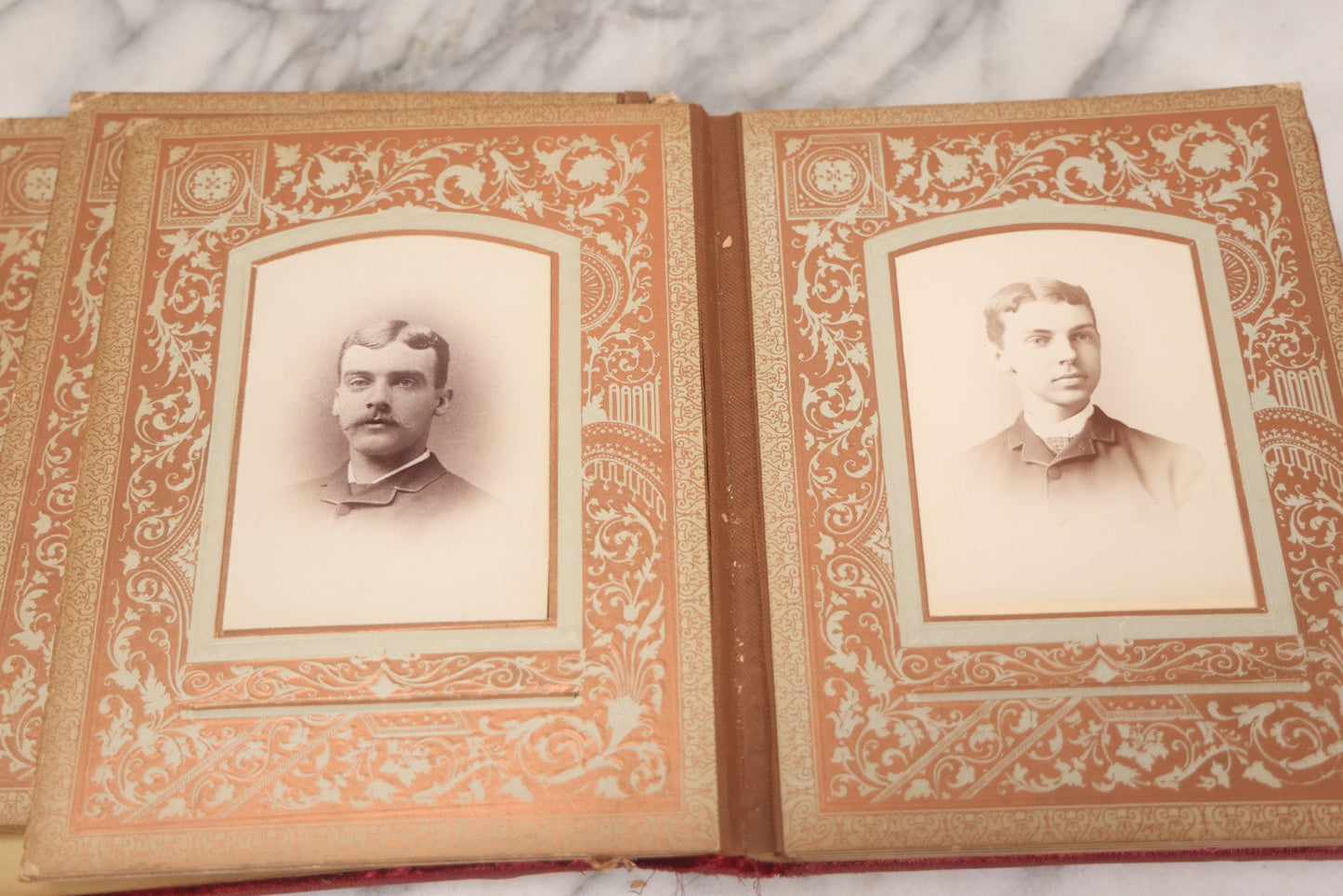 Lot 015 - Antique Victorian Photo Album With Red Velvet Covering, Containing 34 Cabinet Card Photographs, Including Woman Leaning On Gothic Chair, Group Of Four Women And Young Man In Uniform, Note Binding Completely Shot, Many Pages Loose