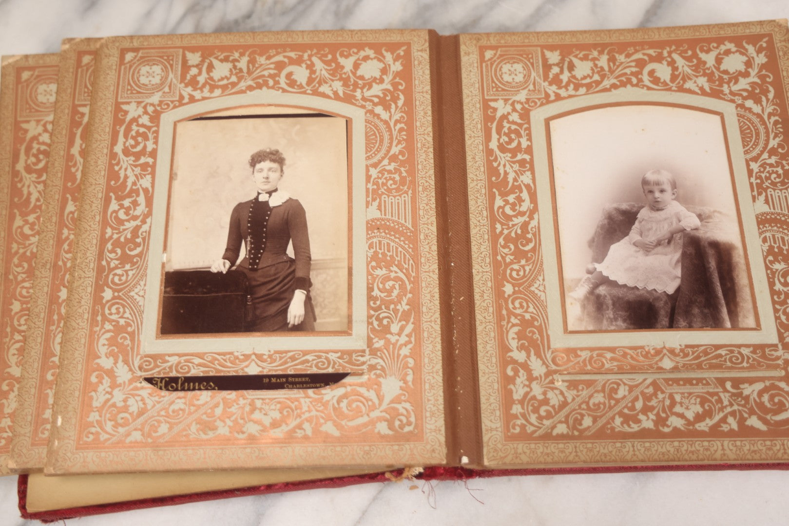 Lot 015 - Antique Victorian Photo Album With Red Velvet Covering, Containing 34 Cabinet Card Photographs, Including Woman Leaning On Gothic Chair, Group Of Four Women And Young Man In Uniform, Note Binding Completely Shot, Many Pages Loose