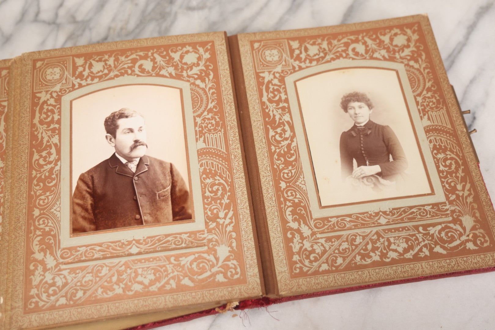 Lot 015 - Antique Victorian Photo Album With Red Velvet Covering, Containing 34 Cabinet Card Photographs, Including Woman Leaning On Gothic Chair, Group Of Four Women And Young Man In Uniform, Note Binding Completely Shot, Many Pages Loose