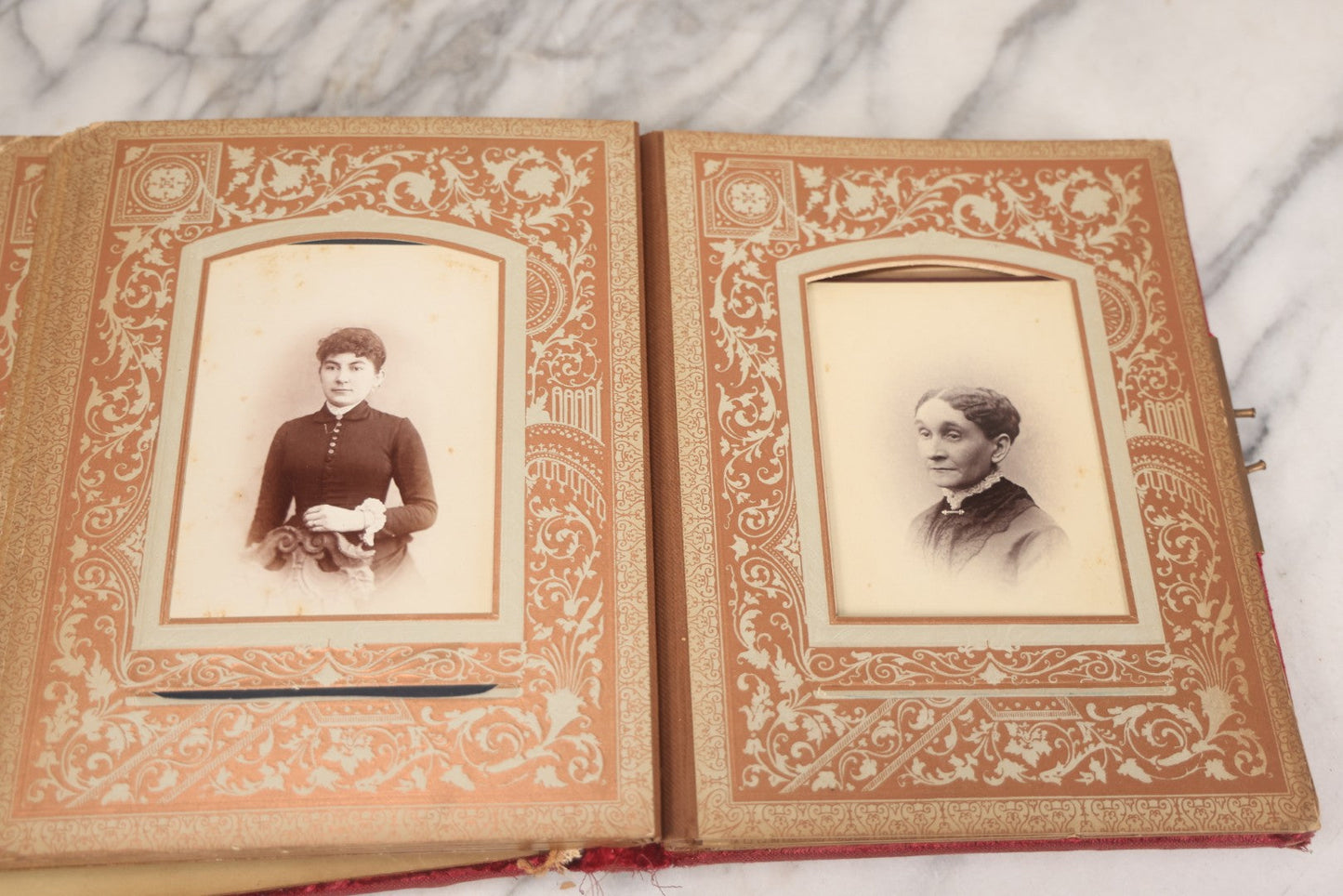 Lot 015 - Antique Victorian Photo Album With Red Velvet Covering, Containing 34 Cabinet Card Photographs, Including Woman Leaning On Gothic Chair, Group Of Four Women And Young Man In Uniform, Note Binding Completely Shot, Many Pages Loose
