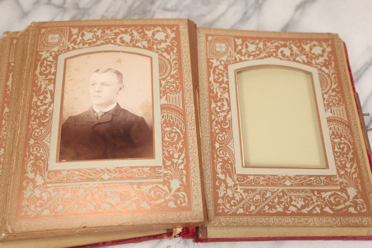 Lot 015 - Antique Victorian Photo Album With Red Velvet Covering, Containing 34 Cabinet Card Photographs, Including Woman Leaning On Gothic Chair, Group Of Four Women And Young Man In Uniform, Note Binding Completely Shot, Many Pages Loose