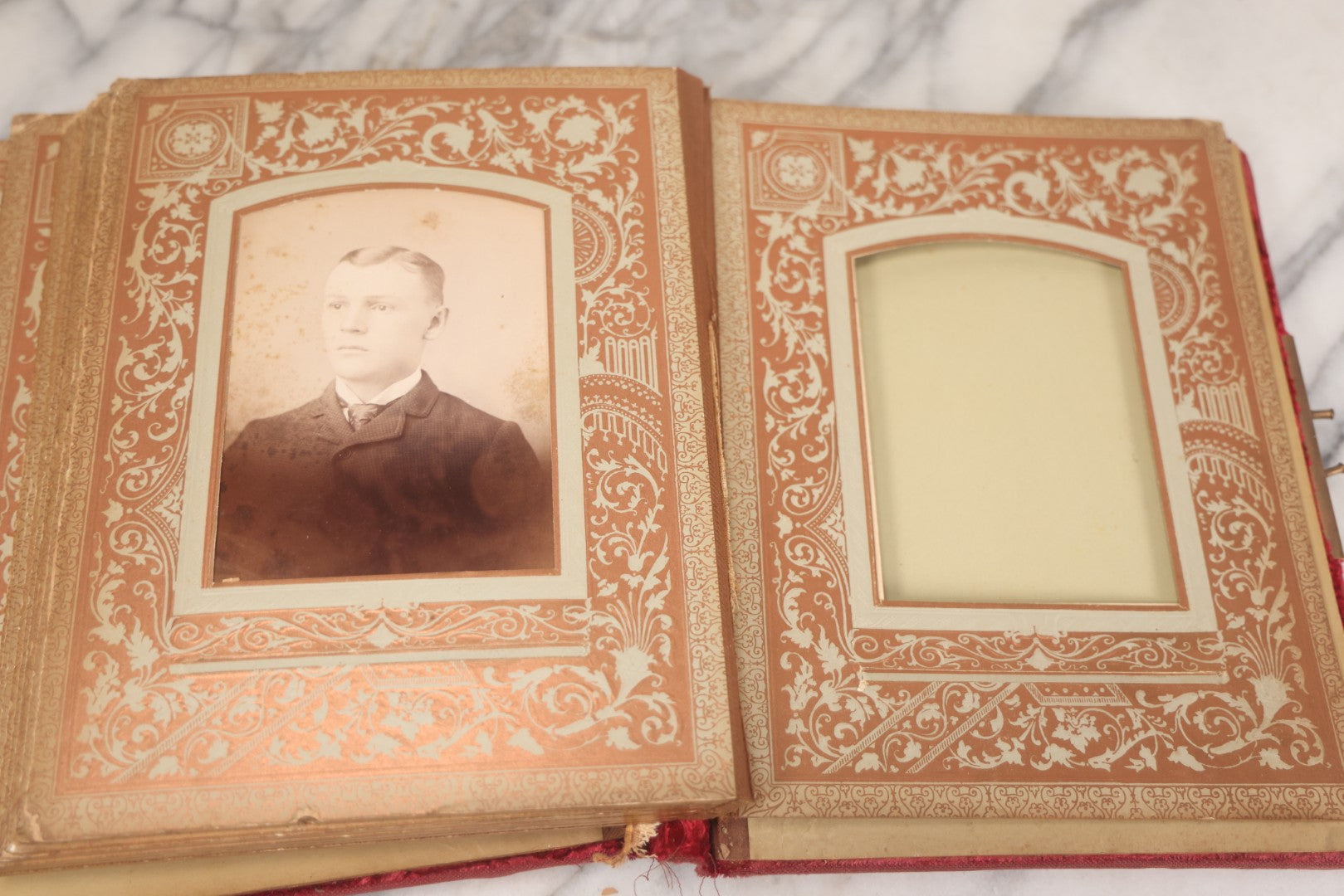Lot 015 - Antique Victorian Photo Album With Red Velvet Covering, Containing 34 Cabinet Card Photographs, Including Woman Leaning On Gothic Chair, Group Of Four Women And Young Man In Uniform, Note Binding Completely Shot, Many Pages Loose