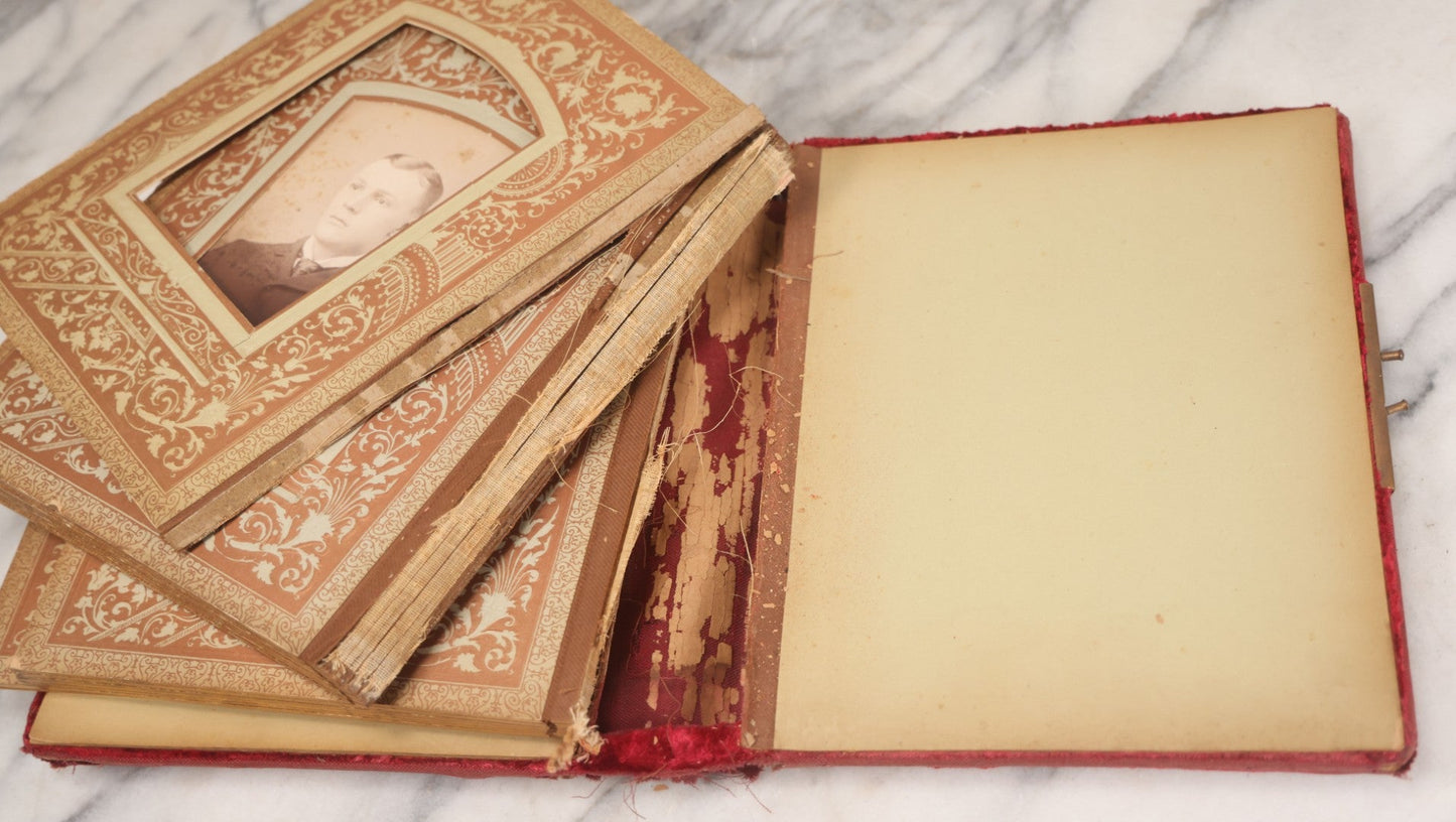 Lot 015 - Antique Victorian Photo Album With Red Velvet Covering, Containing 34 Cabinet Card Photographs, Including Woman Leaning On Gothic Chair, Group Of Four Women And Young Man In Uniform, Note Binding Completely Shot, Many Pages Loose