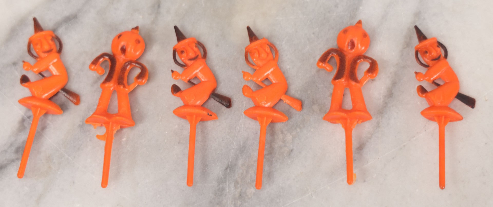 Lot 020 - Grouping Of Six Vintage Orange Plastic Halloween Cake Dessert Toppers Including Two Pumpkin Men And Four Witches, Made In Hong Kong, 2-1/2" L each