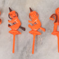 Lot 020 - Grouping Of Six Vintage Orange Plastic Halloween Cake Dessert Toppers Including Two Pumpkin Men And Four Witches, Made In Hong Kong, 2-1/2" L each