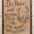 Lot 021 - Antique German Paper Punch Needlework Embroidery Motto, Translates To "The Father Cares With Much Effort For His Children, Late And Early" With Celluloid Angel Figure And Pressed Ferns, In Frame, 12-7/8" x 16-7/8"