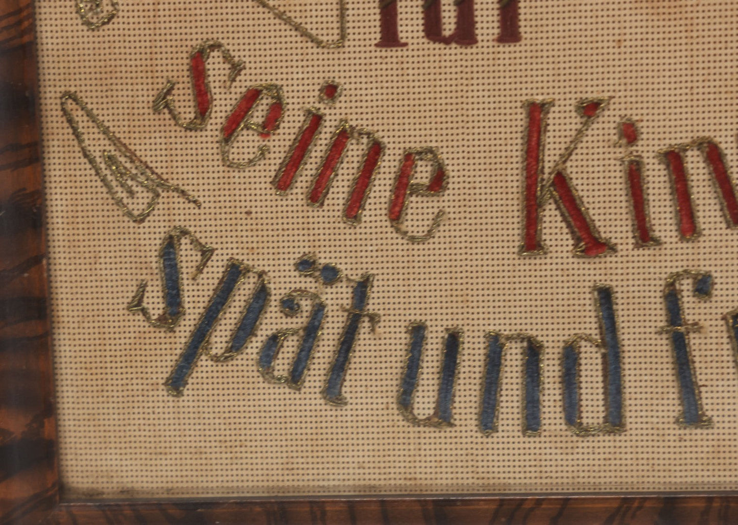 Lot 021 - Antique German Paper Punch Needlework Embroidery Motto, Translates To "The Father Cares With Much Effort For His Children, Late And Early" With Celluloid Angel Figure And Pressed Ferns, In Frame, 12-7/8" x 16-7/8"