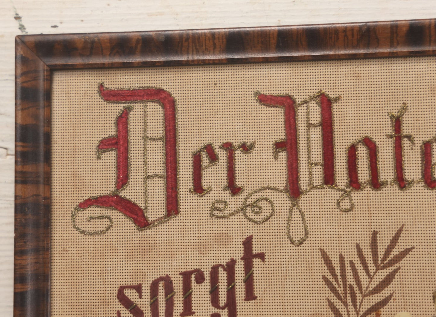 Lot 021 - Antique German Paper Punch Needlework Embroidery Motto, Translates To "The Father Cares With Much Effort For His Children, Late And Early" With Celluloid Angel Figure And Pressed Ferns, In Frame, 12-7/8" x 16-7/8"