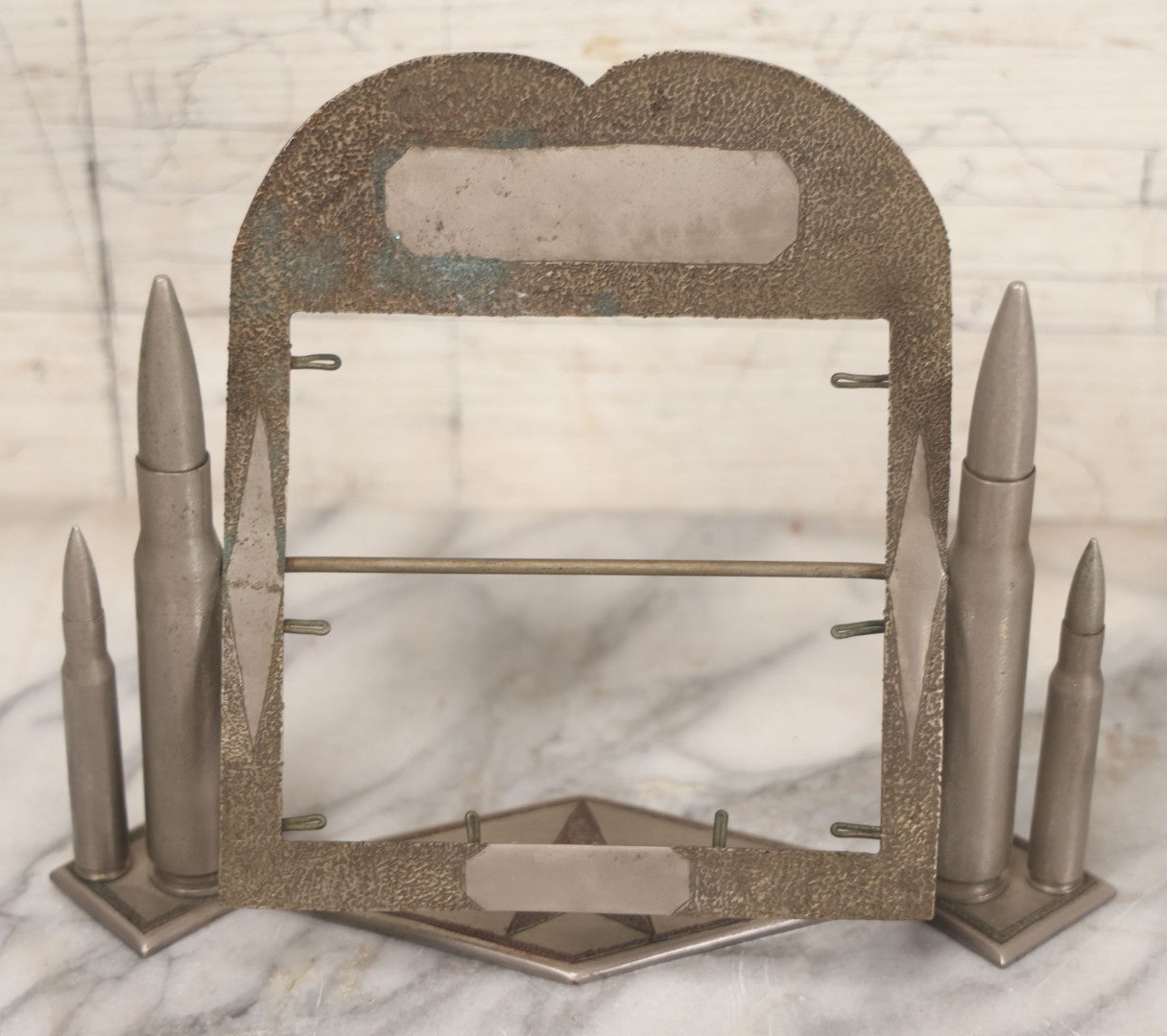 Lot 022 - Vintage Trench Art Swiveling Photo Frame With Silver Painted Bullet Shells, Hand Hammered Star Design And Other Hammered Details, Circa World War 1 Era