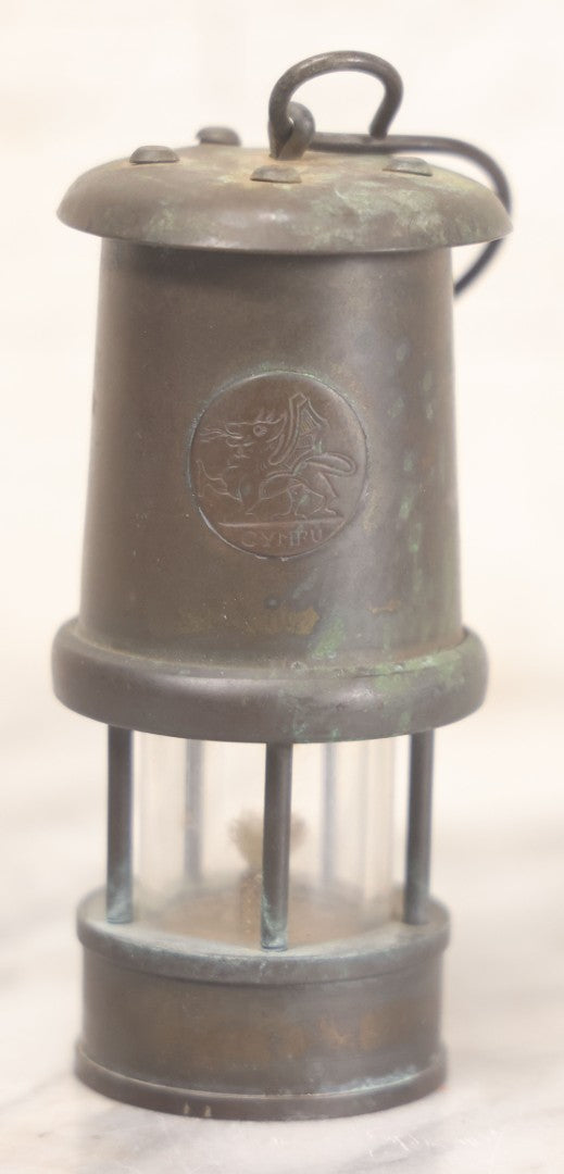 Lot 025 - Antique Brass Coal Miners Lamp Manufactured By Nedd Products Ltd., Glynneath W. Glamorgan, Made In Wales, With Welsh Dragon Emblem And Cymru Welsh Mark, Original Glass And Wick, 4-5/8" H