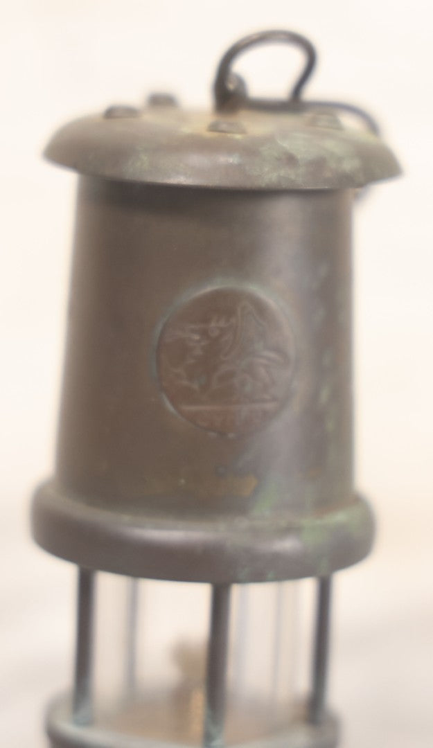 Lot 025 - Antique Brass Coal Miners Lamp Manufactured By Nedd Products Ltd., Glynneath W. Glamorgan, Made In Wales, With Welsh Dragon Emblem And Cymru Welsh Mark, Original Glass And Wick, 4-5/8" H