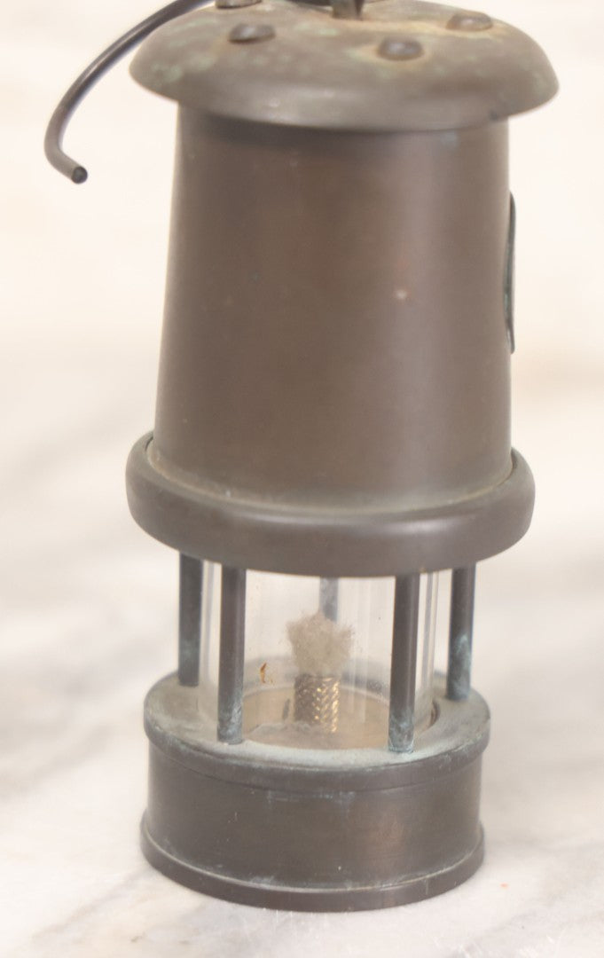 Lot 025 - Antique Brass Coal Miners Lamp Manufactured By Nedd Products Ltd., Glynneath W. Glamorgan, Made In Wales, With Welsh Dragon Emblem And Cymru Welsh Mark, Original Glass And Wick, 4-5/8" H