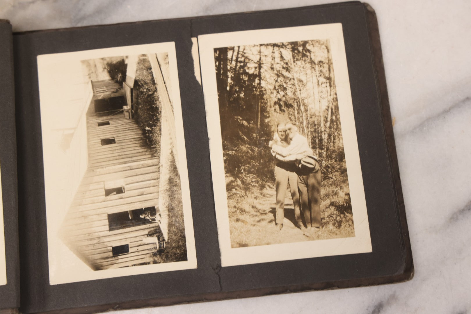 Lot 031 - Vintage Snapshot Photo Album With 46 Snapshot Photographs Including Occupational Photos Of Loggers At Work, Photos Of Children, Mountains, Rivers, And Other Vernacular Photos, Circa 1920s