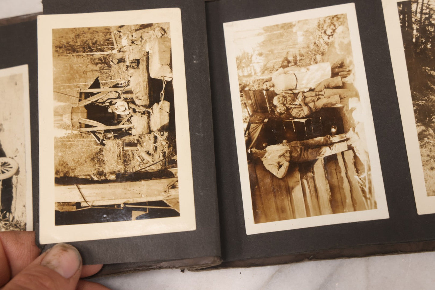 Lot 031 - Vintage Snapshot Photo Album With 46 Snapshot Photographs Including Occupational Photos Of Loggers At Work, Photos Of Children, Mountains, Rivers, And Other Vernacular Photos, Circa 1920s