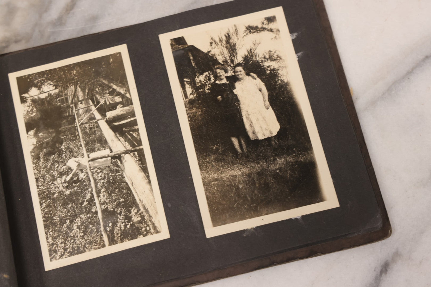 Lot 031 - Vintage Snapshot Photo Album With 46 Snapshot Photographs Including Occupational Photos Of Loggers At Work, Photos Of Children, Mountains, Rivers, And Other Vernacular Photos, Circa 1920s