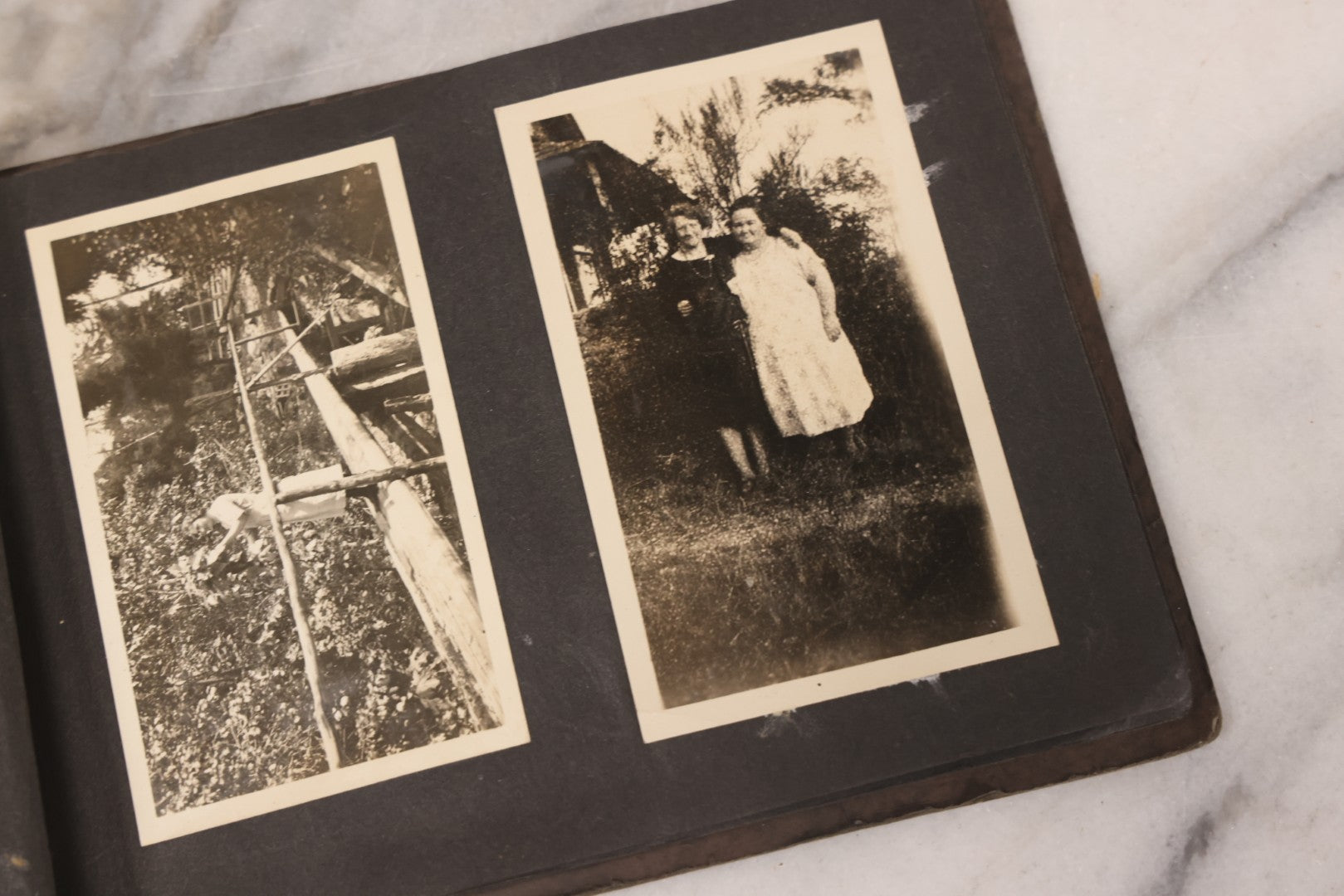 Lot 031 - Vintage Snapshot Photo Album With 46 Snapshot Photographs Including Occupational Photos Of Loggers At Work, Photos Of Children, Mountains, Rivers, And Other Vernacular Photos, Circa 1920s