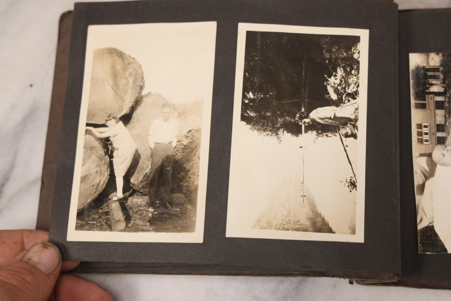 Lot 031 - Vintage Snapshot Photo Album With 46 Snapshot Photographs Including Occupational Photos Of Loggers At Work, Photos Of Children, Mountains, Rivers, And Other Vernacular Photos, Circa 1920s