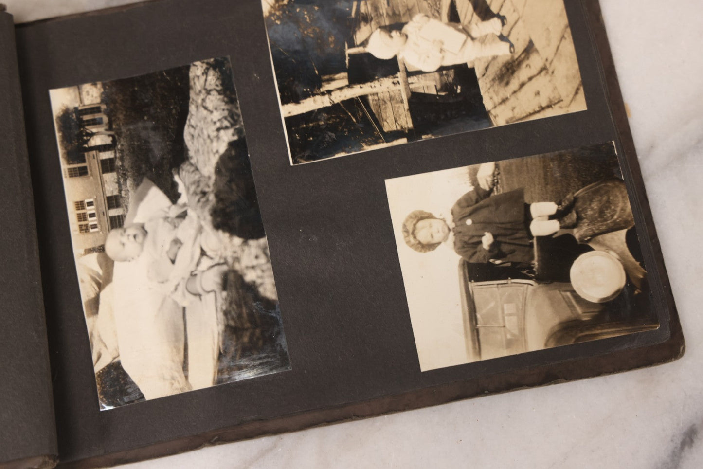 Lot 031 - Vintage Snapshot Photo Album With 46 Snapshot Photographs Including Occupational Photos Of Loggers At Work, Photos Of Children, Mountains, Rivers, And Other Vernacular Photos, Circa 1920s