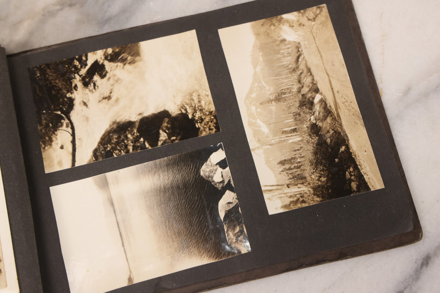 Lot 031 - Vintage Snapshot Photo Album With 46 Snapshot Photographs Including Occupational Photos Of Loggers At Work, Photos Of Children, Mountains, Rivers, And Other Vernacular Photos, Circa 1920s