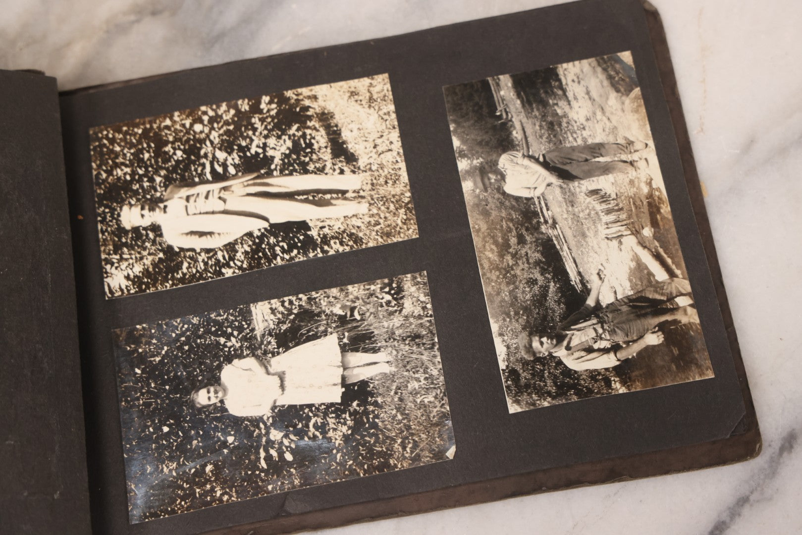 Lot 031 - Vintage Snapshot Photo Album With 46 Snapshot Photographs Including Occupational Photos Of Loggers At Work, Photos Of Children, Mountains, Rivers, And Other Vernacular Photos, Circa 1920s