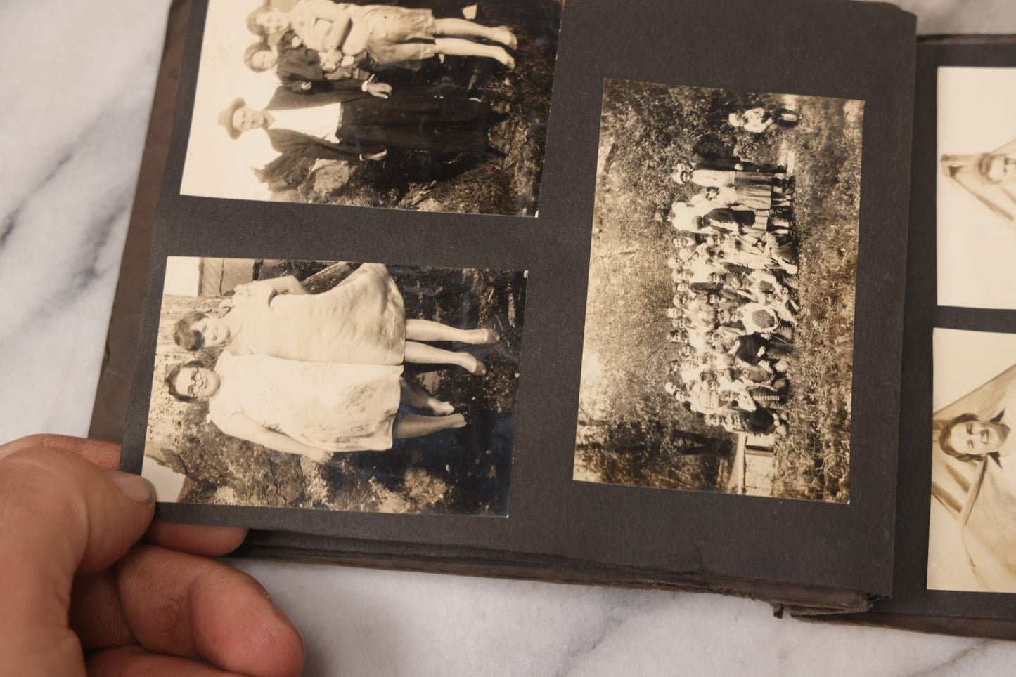 Lot 031 - Vintage Snapshot Photo Album With 46 Snapshot Photographs Including Occupational Photos Of Loggers At Work, Photos Of Children, Mountains, Rivers, And Other Vernacular Photos, Circa 1920s