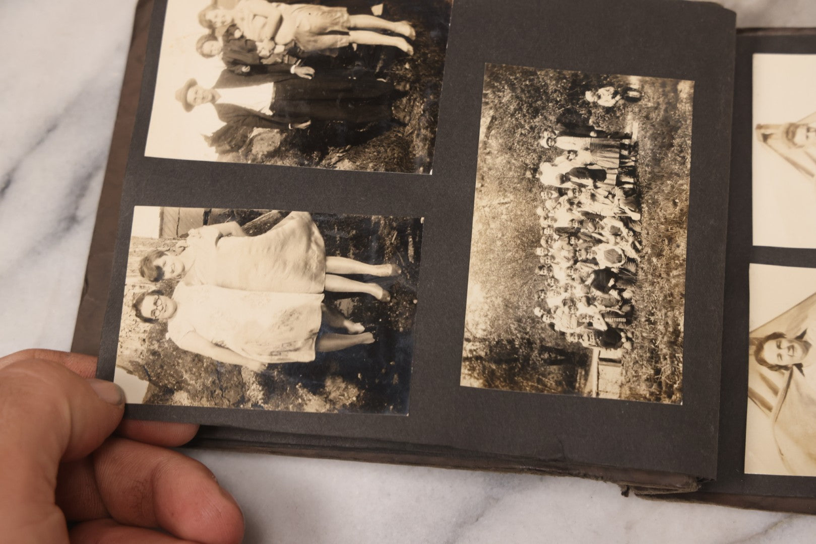 Lot 031 - Vintage Snapshot Photo Album With 46 Snapshot Photographs Including Occupational Photos Of Loggers At Work, Photos Of Children, Mountains, Rivers, And Other Vernacular Photos, Circa 1920s