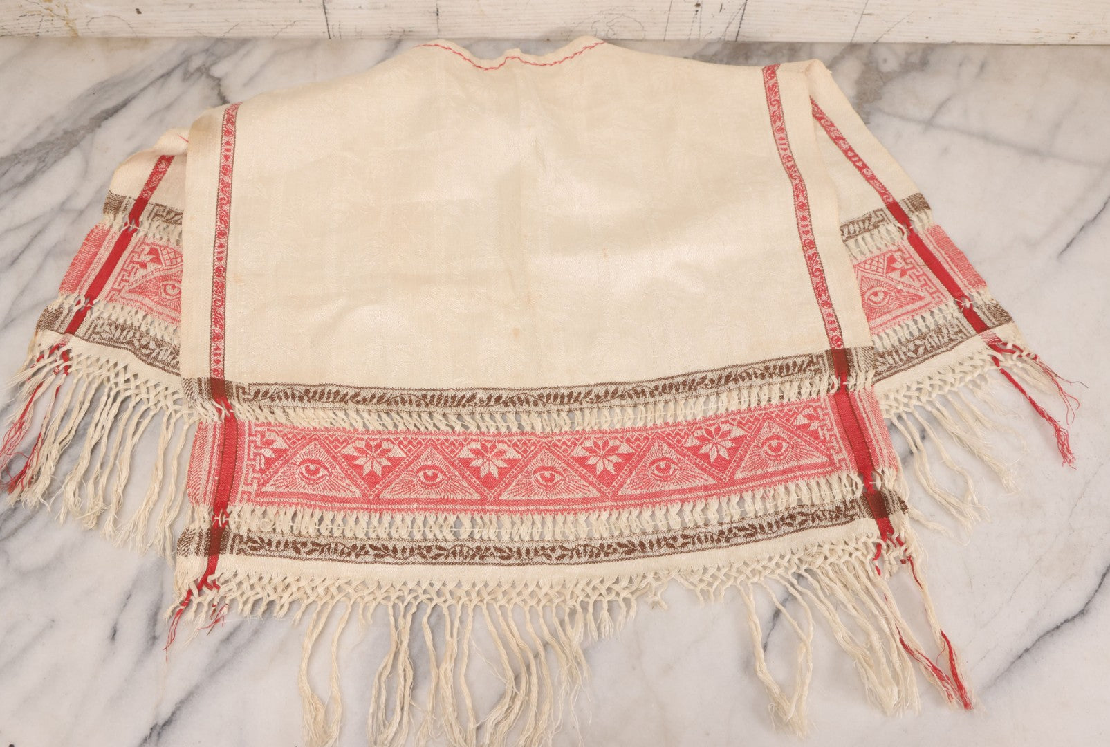 Lot 035 - Antique Damask Textile Fabric Bib With Detailed Red Embroidery Featuring All Seeing Eye, Comb And Brush And Hairpin Motifs