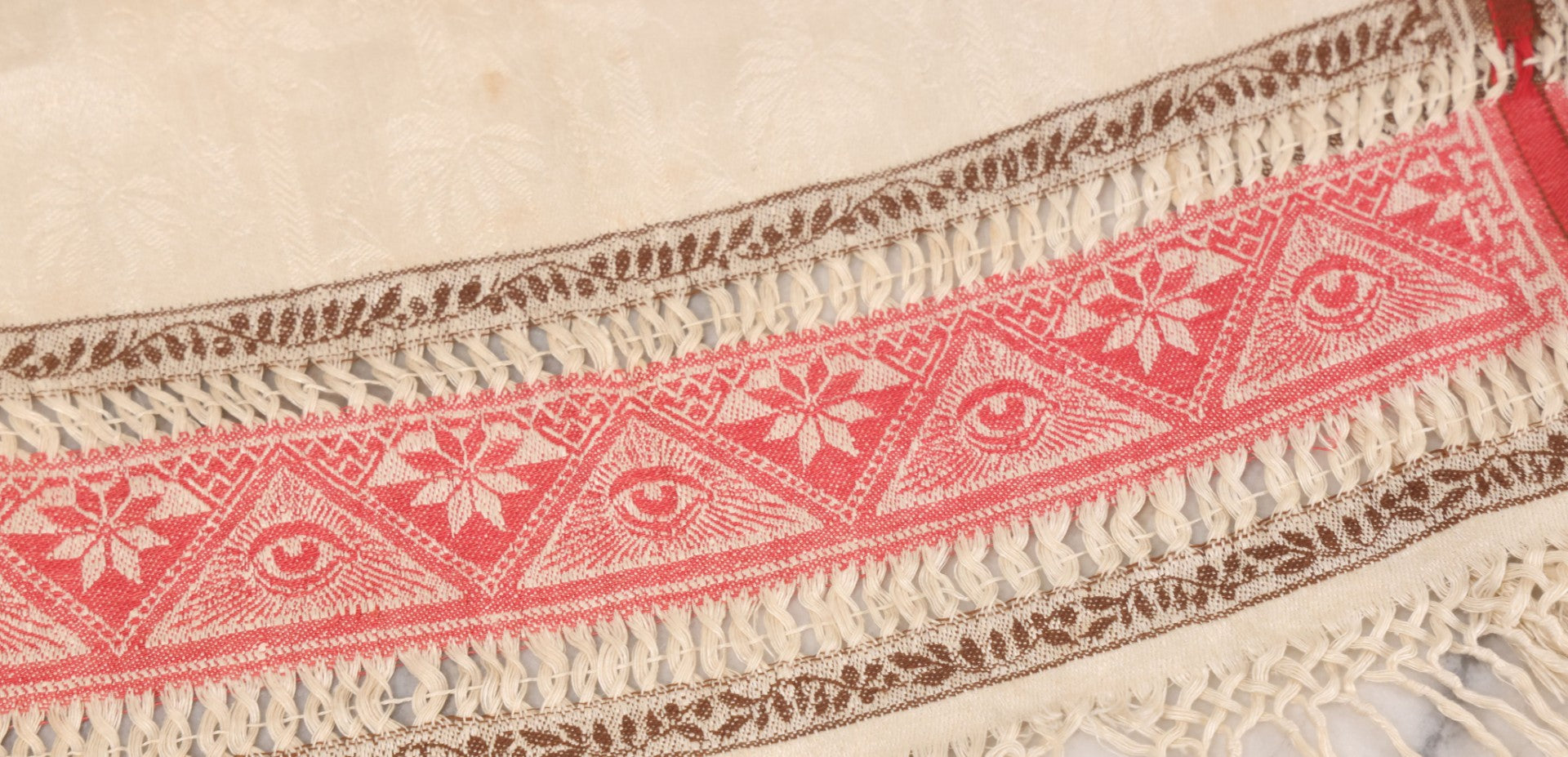 Lot 035 - Antique Damask Textile Fabric Bib With Detailed Red Embroidery Featuring All Seeing Eye, Comb And Brush And Hairpin Motifs