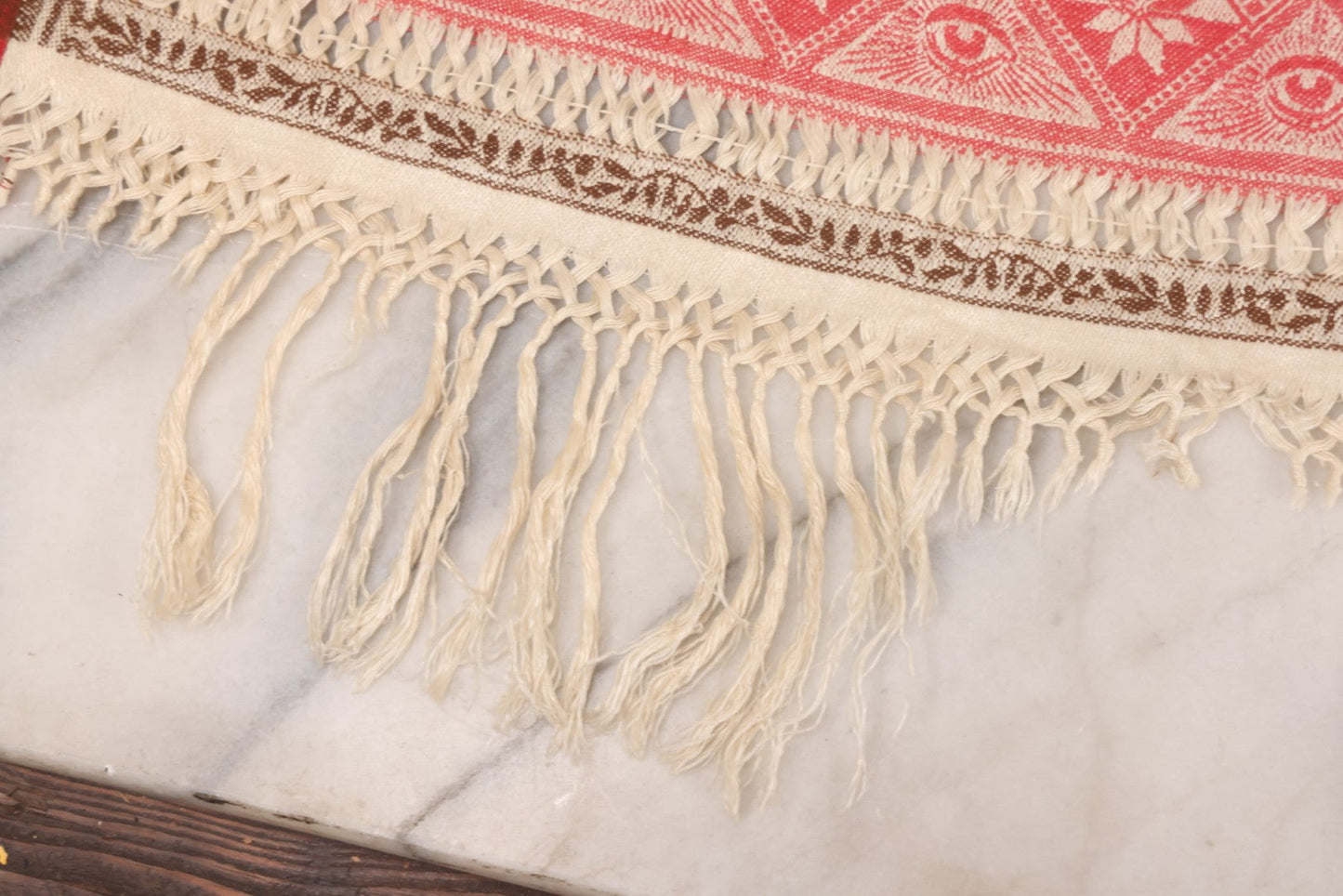 Lot 035 - Antique Damask Textile Fabric Bib With Detailed Red Embroidery Featuring All Seeing Eye, Comb And Brush And Hairpin Motifs