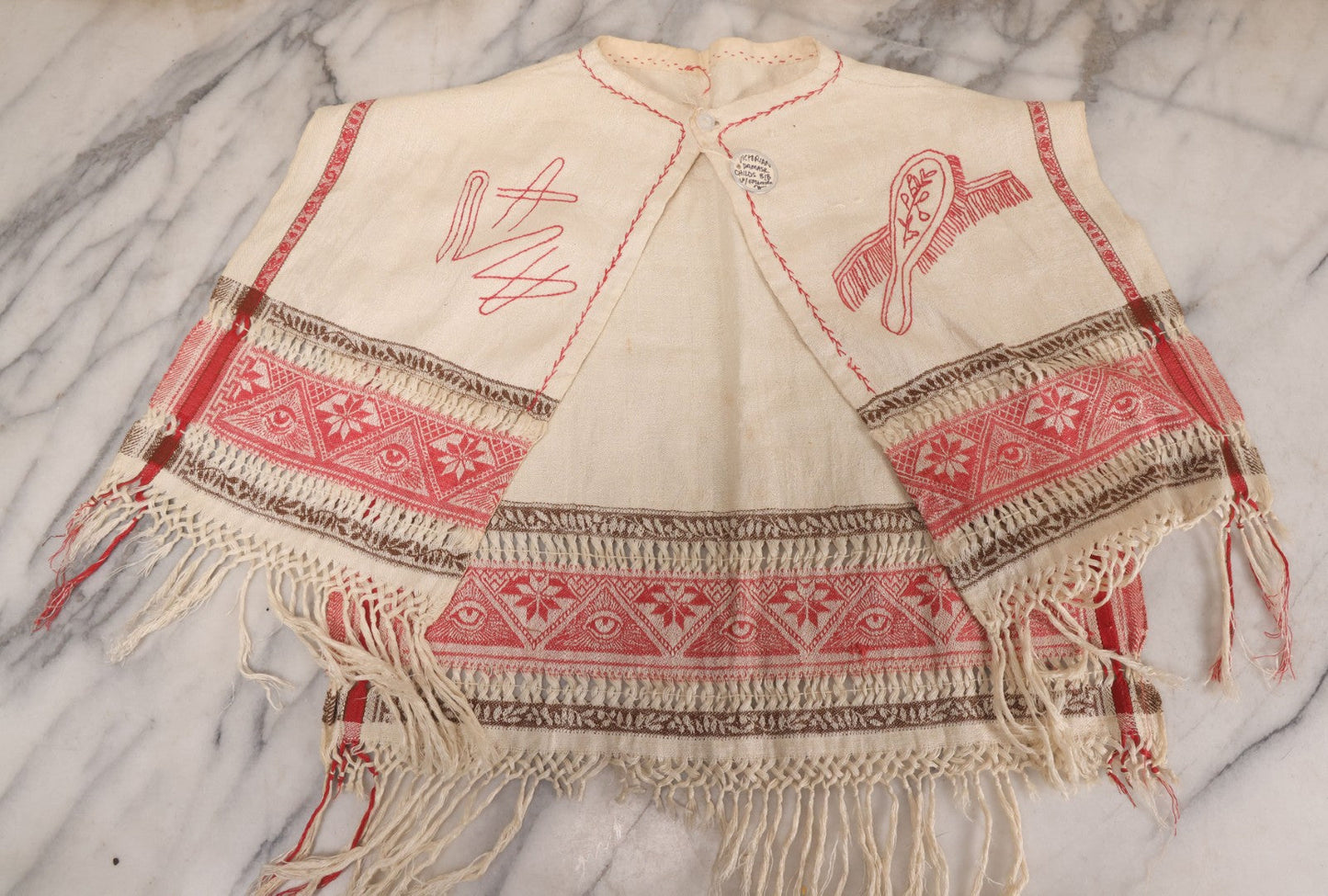 Lot 035 - Antique Damask Textile Fabric Bib With Detailed Red Embroidery Featuring All Seeing Eye, Comb And Brush And Hairpin Motifs