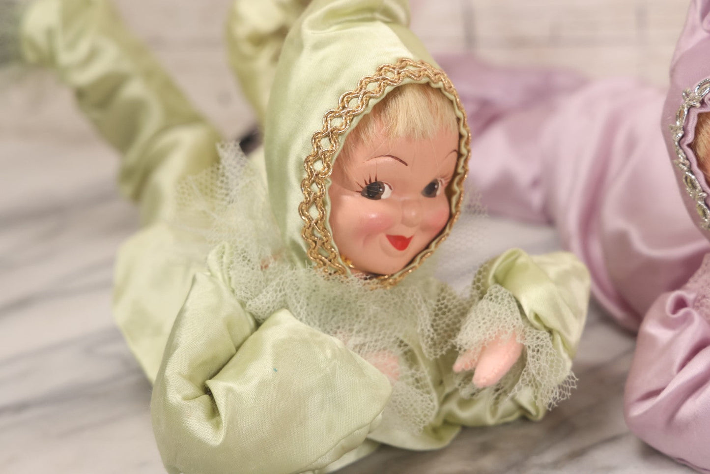 Lot 038 - Pair Of Vintage Mid Century Pixie Sweetheart Elf Dolls In Pink And Green Outfits And Prone Pose