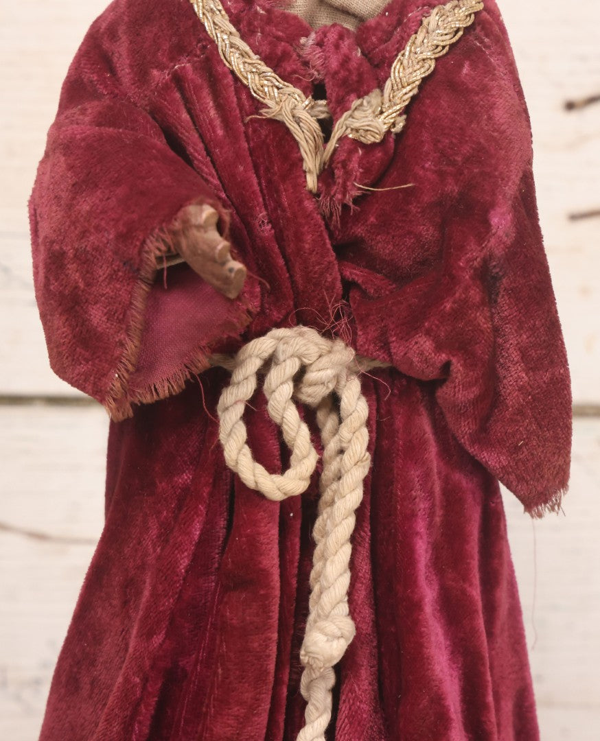 Lot 047 - Antique Handmade Religious Saint Statue Santos Figure With Carved Wooden Head, Hand And Feet, Original Paint, Real Hair Eyebrows, And Maroon Velvet Robe, Note Missing Hand, 16" H